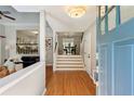 Inviting entryway with hardwood floors and views into the living and dining areas at 550 Ambergate Ct, Roswell, GA 30076