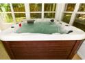 Close up of hot tub filled with water, and built in seating at 3239 Rose Petal Ln, Powder Springs, GA 30127