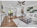 Spacious living area showcasing hardwood floors, stylish decor, and an adjacent dining space at 2793 Horse Shoe Dr, Atlanta, GA 30316