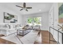 Bright living room featuring hardwood floors, neutral furniture, and a large window with natural light at 2793 Horse Shoe Dr, Atlanta, GA 30316