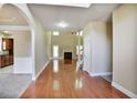 Bright living room with hardwood floors, fireplace, and large windows offering natural light at 1544 English Manor Cir, Stone Mountain, GA 30087