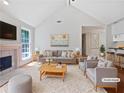 Bright living room featuring a fireplace, plush rug, and stylish contemporary furniture at 1704 Golf Link Dr, Stone Mountain, GA 30088