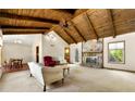 Cozy living room with vaulted wood ceilings, stone fireplace and an open concept layout at 3923 Lookout Point Dr, Marietta, GA 30066