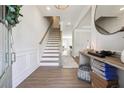 Bright foyer with hardwood floors, staircase, and stylish decor, offering a warm welcome at 2860 Windsor Knoll Dr, Dacula, GA 30019