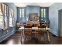 Bright and airy dining room with a brick fireplace, built-in bookshelves, and large windows at 836 Dill Sw Ave, Atlanta, GA 30310