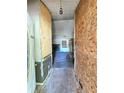 Entryway featuring incomplete walls, old carpet, and a view into a living area with a fireplace at 35 Belmont Way, Covington, GA 30016