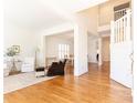 Bright living room with hardwood floors and open floor plan to dining area at 3759 Wescott Ne Cv, Brookhaven, GA 30319
