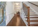 Elegant foyer with hardwood floors, staircase, and detailed trim, offering a grand entrance to the home at 518 Coral St, Marietta, GA 30064