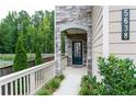 Inviting front entrance with stone accents and manicured greenery, creating a welcoming first impression at 5638 Berney Cir, Powder Springs, GA 30127