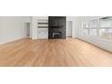 Open living room with hardwood floors, fireplace, and built-in shelves at 2059 Mozelle Dr, Marietta, GA 30062