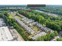 Aerial view of the community, surrounded by lush trees and showing the neighborhood layout at 3409 Catalan Aly, Decatur, GA 30032
