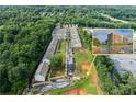 Expansive aerial view of community and surrounding trees, with nearby building inset at 3409 Catalan Aly, Decatur, GA 30032