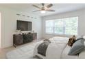 Cozy main bedroom with a large window, stylish dresser, and comfortable bed setting at 3409 Catalan Aly, Decatur, GA 30032