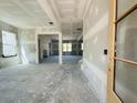 Unfinished spacious living room showing rough drywall, large windows, and natural light at 3375 Hillshire Dr, Cumming, GA 30028