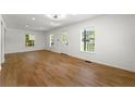 Spacious living room with hardwood floors and natural light from multiple windows at 1917 Connally Dr, Atlanta, GA 30344