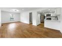 Open living area with hardwood floors connecting to a modern kitchen at 1917 Connally Dr, Atlanta, GA 30344