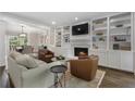 Inviting living room boasts built-in bookshelves, a cozy fireplace, and elegant furnishings perfect for relaxation at 660 Willow Knoll Se Dr, Marietta, GA 30067