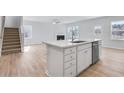 Elegant kitchen with island, open to living area and staircase at 108 Aj Welch Jr Way, Mcdonough, GA 30252