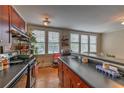 Bright kitchen showcasing dark cabinets, hardwood floors, plenty of natural light and breakfast bar overlooking the adjacent living area at 733 Frederica Ne St # 2, Atlanta, GA 30306