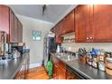 Functional kitchen features dark countertops, ample cabinet space, a black refrigerator and stainless steel sink and appliances at 733 Frederica Ne St # 2, Atlanta, GA 30306
