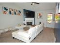 Inviting living room with a cozy fireplace, a stylish couch, and modern decor at 2176 Cold Springs Cir, Lithonia, GA 30058