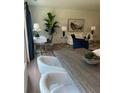 Cozy living space showcasing modern decor, a work desk, and elegant furnishings at 1567 Aiden Way # 34, Conyers, GA 30013