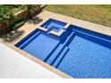 In-ground pool with in-ground spa, perfect for relaxing and enjoying the outdoors at 526 Lost Creek Dr, Woodstock, GA 30188