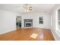 Spacious living room with hardwood floors and views into the kitchen at 560 Austin Dr, Mcdonough, GA 30252