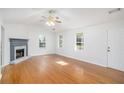 Bright living room with hardwood floors, fireplace, and lots of natural light at 560 Austin Dr, Mcdonough, GA 30252