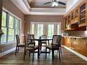Cozy dining area featuring a modern table set and picturesque views through large windows at 225 Austin Oaks Se Dr, Ellenwood, GA 30294