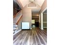 Spacious foyer with staircase and wood floors at 225 Austin Oaks Se Dr, Ellenwood, GA 30294