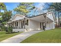 Well-maintained single-story home with brick exterior, covered front porch, and a convenient side carport at 2198 Star Mist Sw Dr, Atlanta, GA 30311