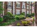 Beautifully landscaped front yard with lush greenery and colorful flower beds at 20 Collier Nw Rd # 11, Atlanta, GA 30309