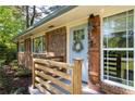 Close-up of the front door with a wreath, address numbers, and wood accents at 1650 Randee Nw St, Atlanta, GA 30318