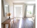 Inviting foyer with hardwood floors, a decorative bench, and plenty of natural light at 175 Diamond Ridge Ave, Canton, GA 30114