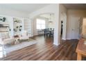 Bright living room featuring hardwood floors and built-in bookshelves at 175 Diamond Ridge Ave, Canton, GA 30114
