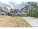 Beautiful one-story home featuring well-maintained lawn, long driveway, and welcoming facade at 315 Fieldridge Dr, Lawrenceville, GA 30045