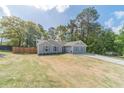 Attractive single-level house with a well-kept lawn, long driveway, and inviting curb appeal at 315 Fieldridge Dr, Lawrenceville, GA 30045