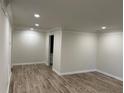 Spacious living room featuring wood-look floors, fresh paint and recessed lighting at 3071 Colonial Way # K, Atlanta, GA 30341