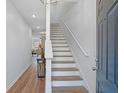 Inviting entryway with hardwood floors and staircase leading to the upper level at 1688 Jackson Sq, Atlanta, GA 30318