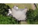 Bird's-eye view of a house showcasing a well-maintained roof, private deck, and lush greenery at 1770 Bethany Spring, Cumming, GA 30041