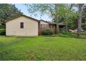 A large grass back yard and exterior view of this ranch style home at 1911 Lavista Ne Rd, Atlanta, GA 30329