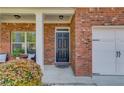 Welcoming front porch with brick facade and decorative door, leading to a charming home at 1691 Scenic Pines Dr, Lawrenceville, GA 30044
