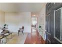 Inviting entry features hardwood floors, wainscoting, and seamless transitions to other living spaces at 1691 Scenic Pines Dr, Lawrenceville, GA 30044