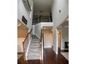 Entryway with staircase leading to a living room with coffered ceilings at 4685 Columbia St, Cumming, GA 30040