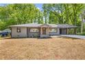 Beautiful single-story home with a covered carport and well-manicured front yard at 1995 Mcafee Rd, Decatur, GA 30032