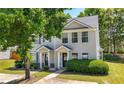 Inviting two-story townhome showcasing manicured lawn and covered entrance at 625 Outlook Way, Atlanta, GA 30349