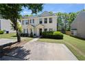 Attractive two-story townhome with well-maintained lawn and convenient parking at 625 Outlook Way, Atlanta, GA 30349