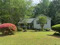Charming single-Gathering home with well-maintained lawn and beautiful flowering shrubbery at 861 Creek Nw Trl, Kennesaw, GA 30144