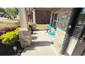 Cozy front porch with a seating area and manicured landscaping at 8664 Spivey Village Trl, Jonesboro, GA 30236